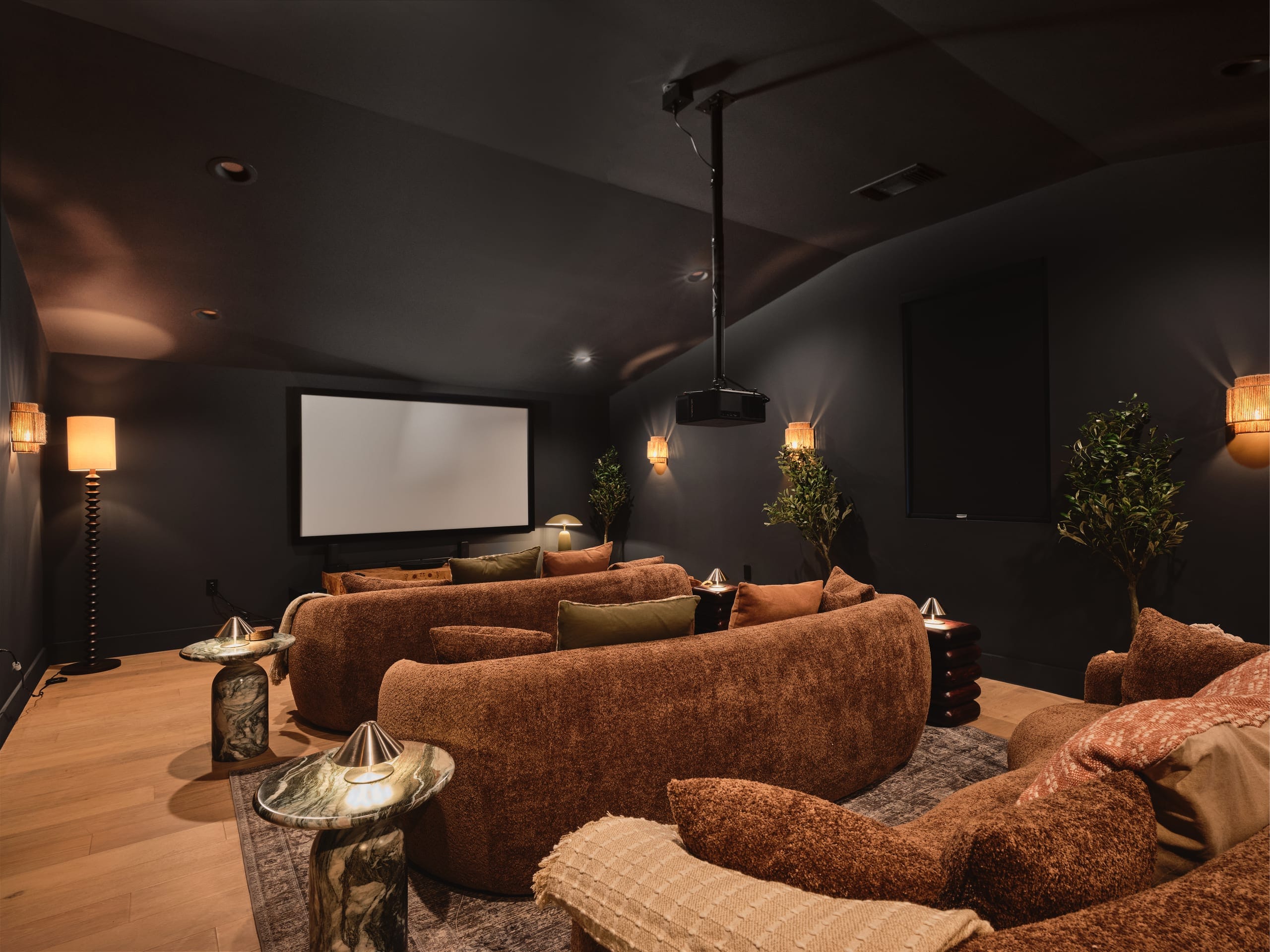 The 14-seat upstairs theatre with tiered seating and projector screen